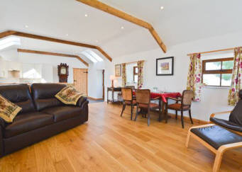 Comfortable lounge and dining area at  Curlew Cottage, Lilswood Farm, Hexham, Northumberland  uk